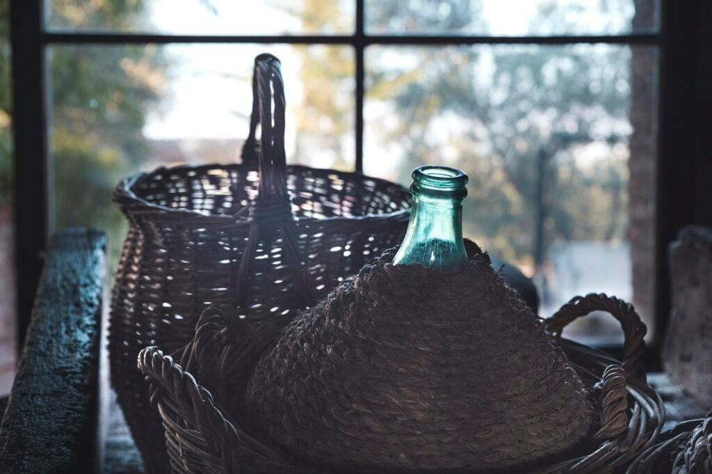 carboy and wicker basket