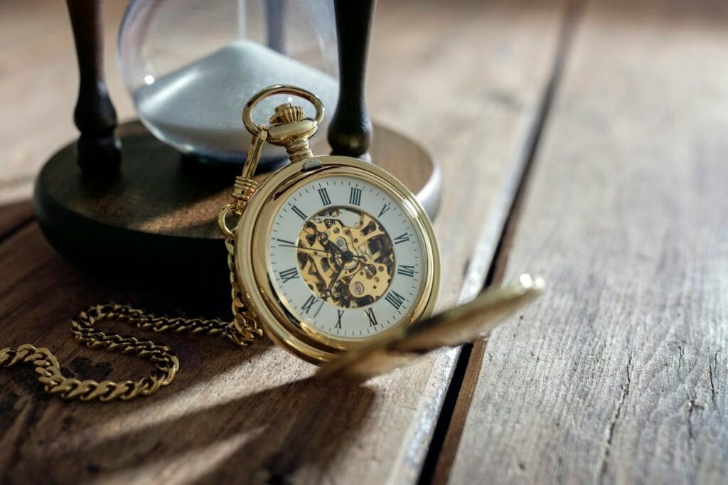 Gold pocket watch and hourglass. Helps time mead fermentation