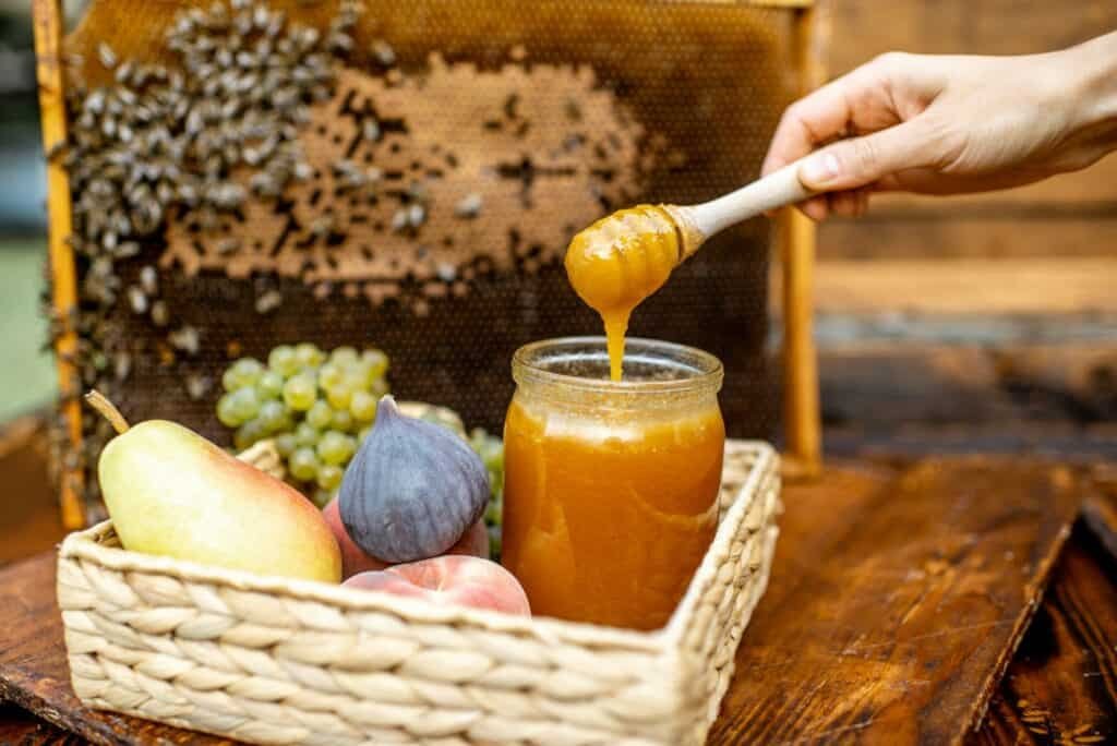 Sweet fruits and honey on the beehive