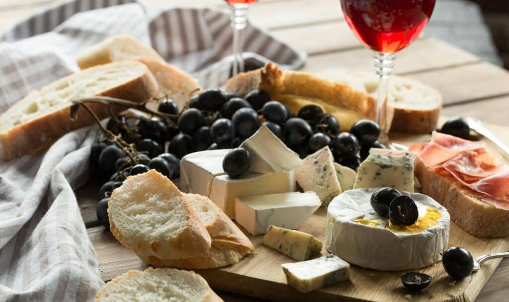 Assorted Cheeses and Fruit Plate. An assorted variety of fresh cheeses, fruits and nuts